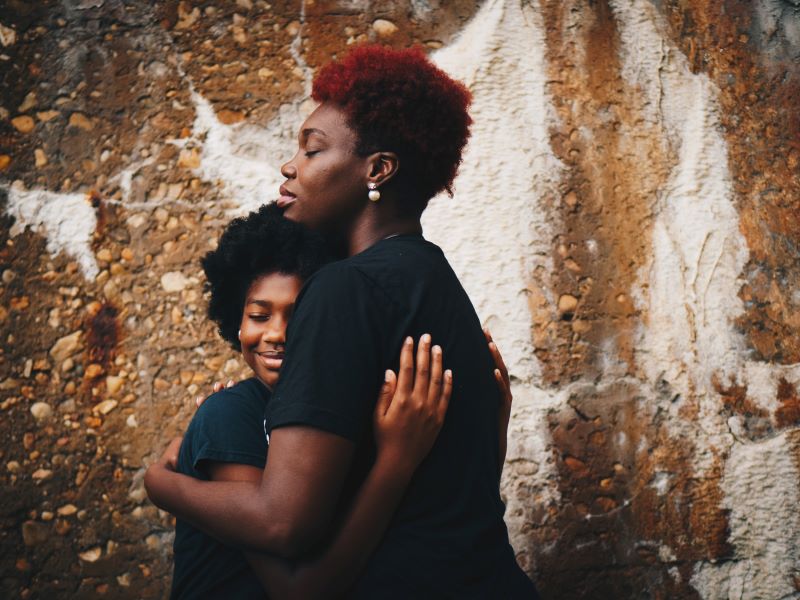 family-therapy-black-woman-hugging-daughter.jpg
